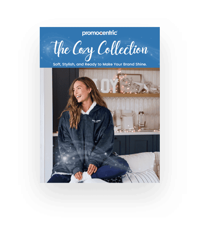 Cozy happy woman wearing branded blanket